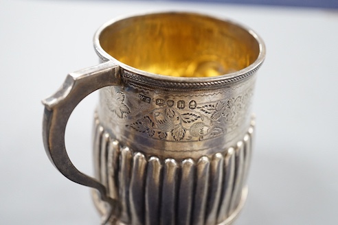 A George IV demi-fluted silver christening mug, with later engraved inscription, London, 1823, 69mm.